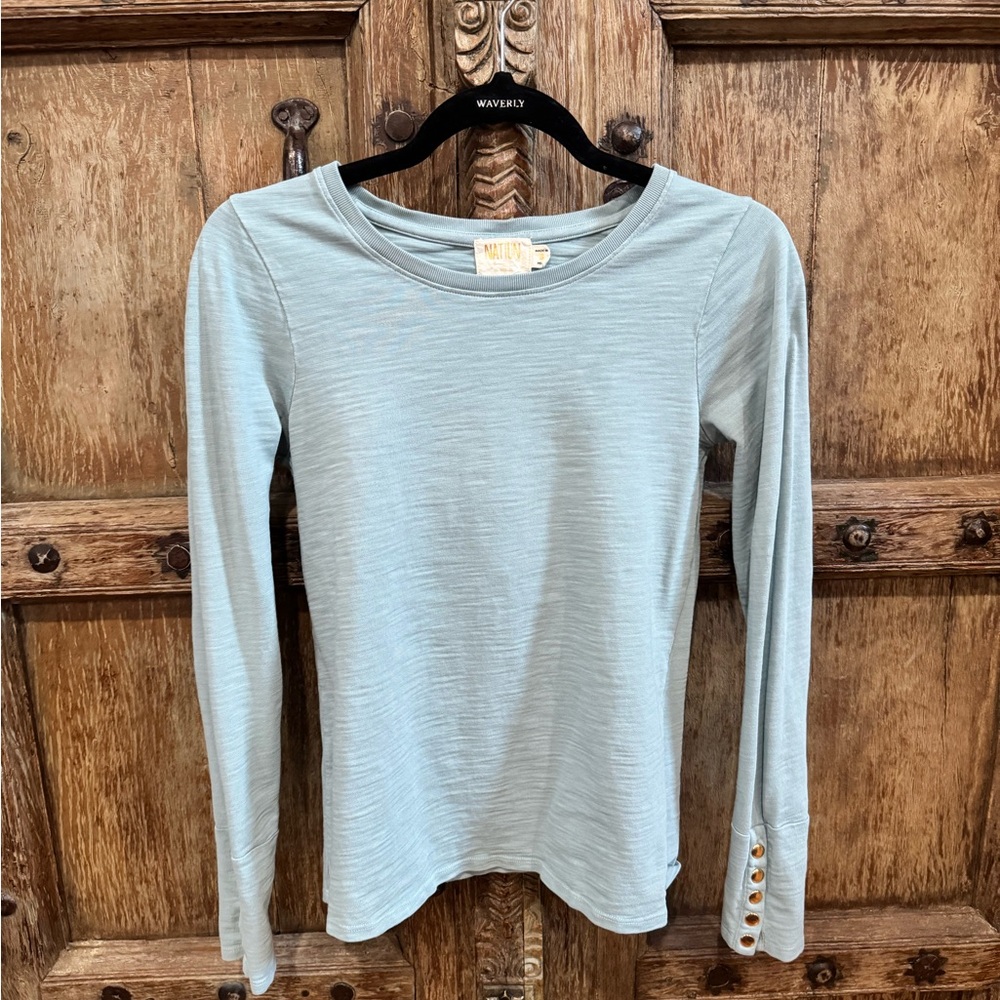 Seafoam green Nation LTD top with gold buttons at the cuffs
